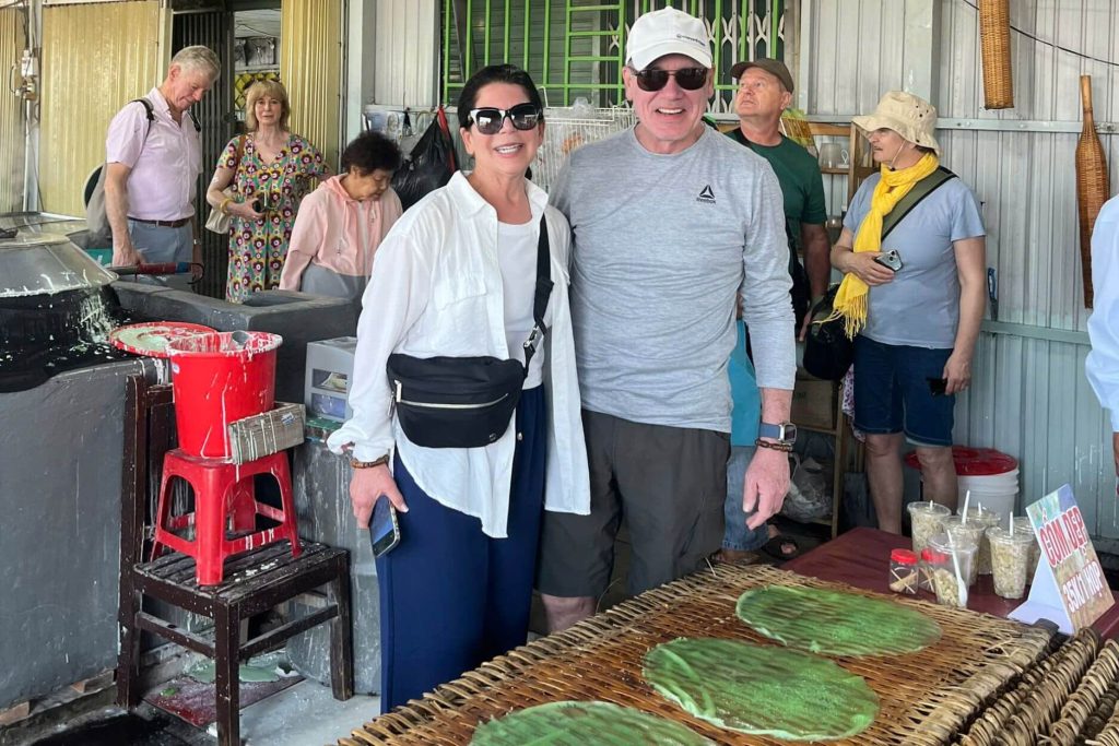 couple visit traditional village in Mekong Delta - Saigon tours