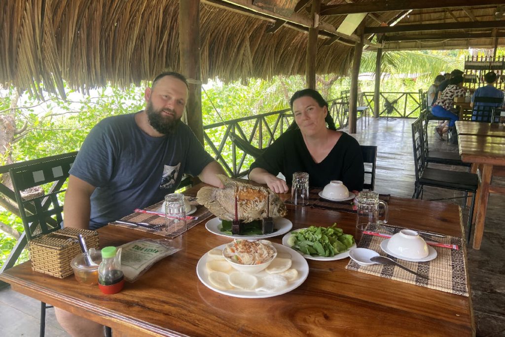 Couple-have-lunch-in-Mekong Delta-Ho-Chi-Minh-city-tours