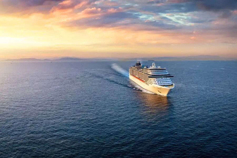 Cruise ship sailing at sunset after a shore excursion in Southeast Asia