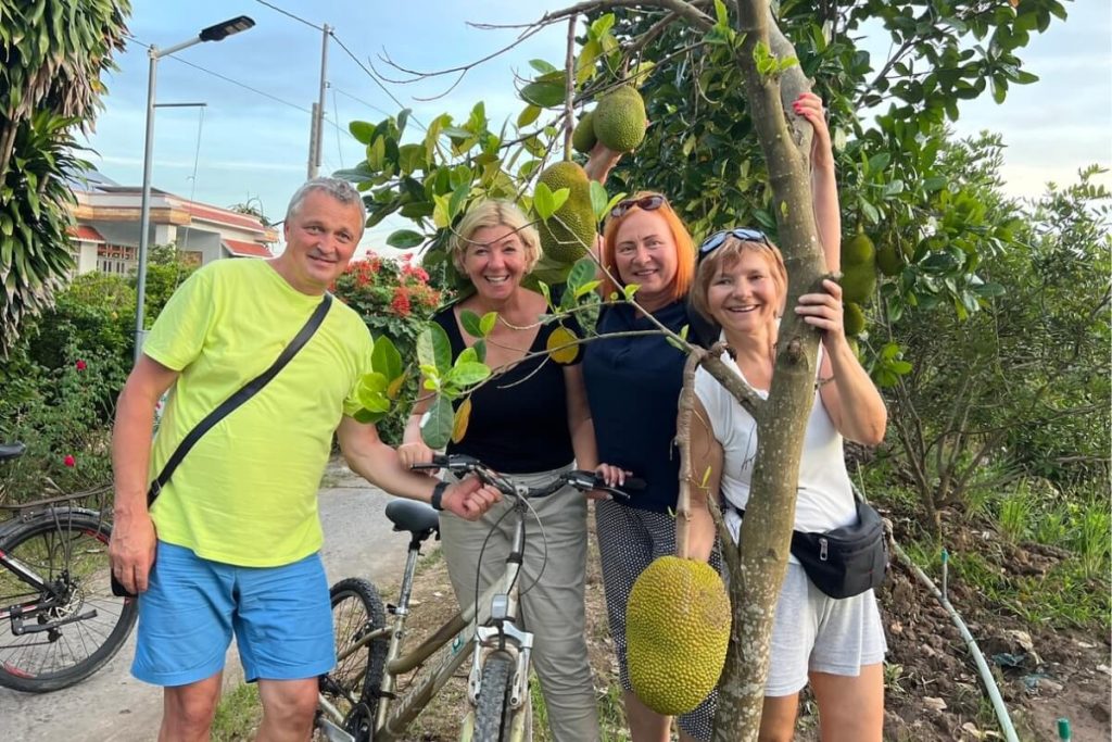 Cycling through local farm and enjoy fruit in Mekong Delta Tour