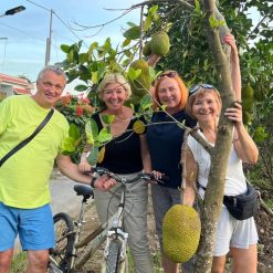 Cycling through local farm and enjoy fruit in Mekong Delta Tour