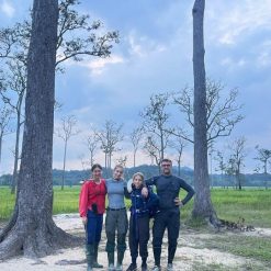 Family trekking through the rainforest of Cat Tien National Park