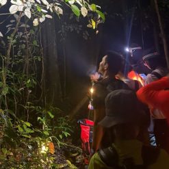 Happy travelers on a guided night trek in Cat Tien