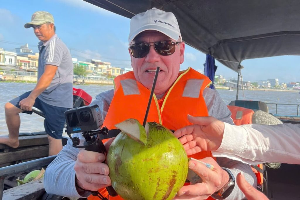 Take a rest and enjoy fresh coconut juice in Mekong Delta Tour