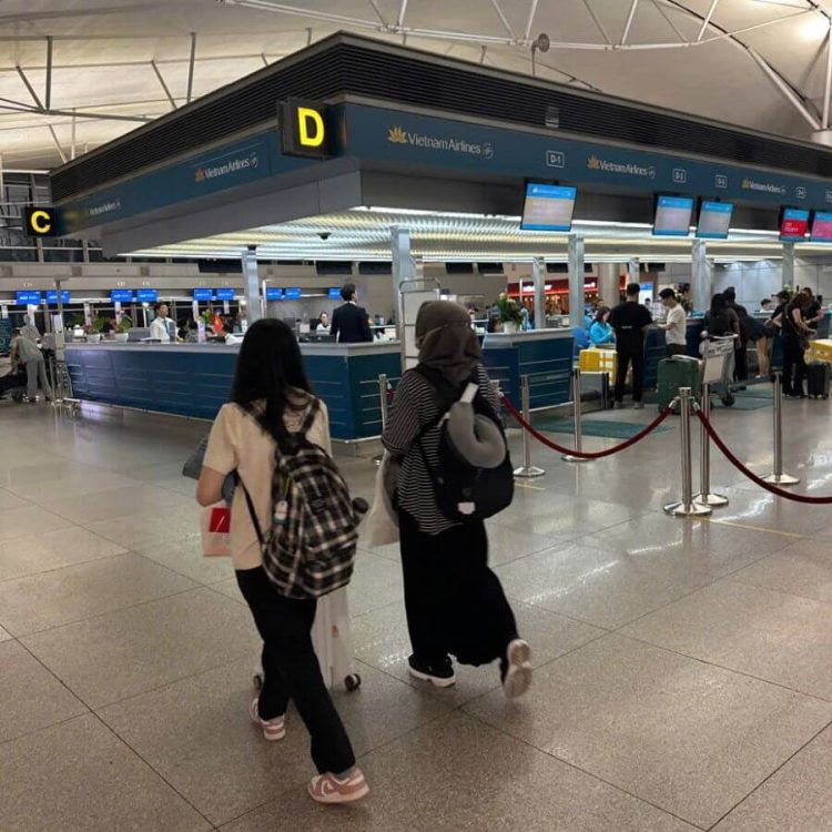 Two women using fast track departure ho chi minh at tan son nhat airport - saigon local tour