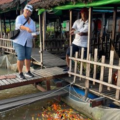 Visit fish farm in Mekong local family