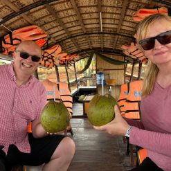 enjoy coconut juice in mekong delta