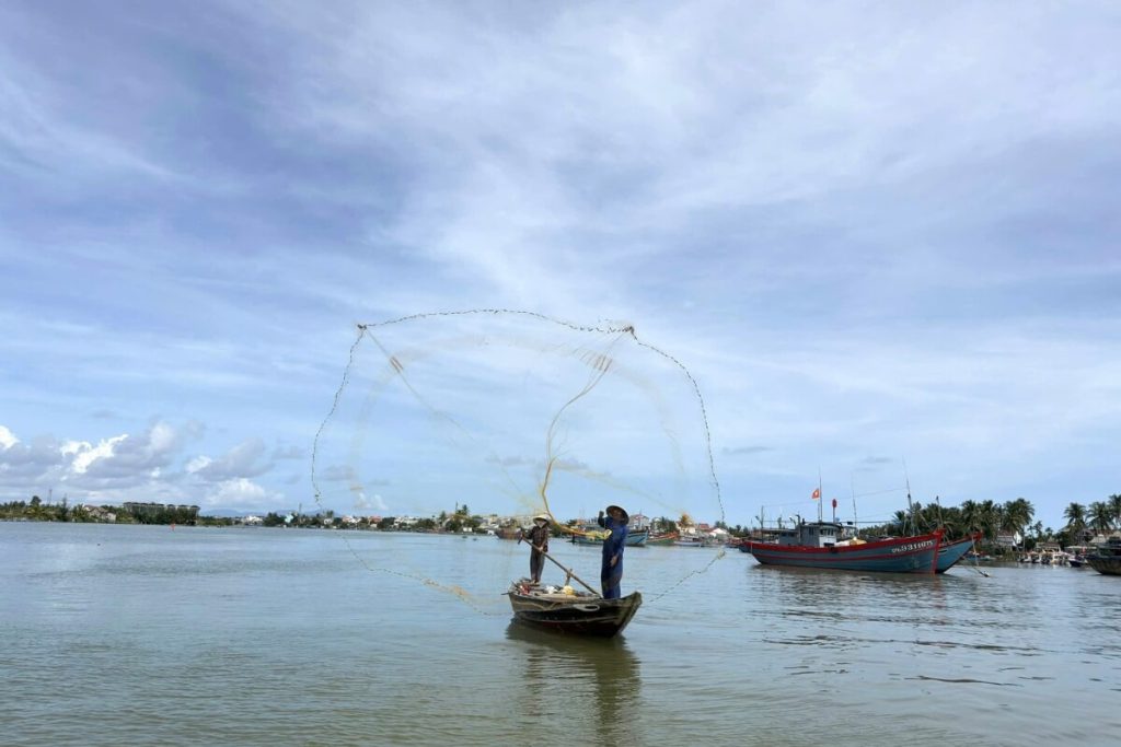 fishing with a net in vietnam local tour package