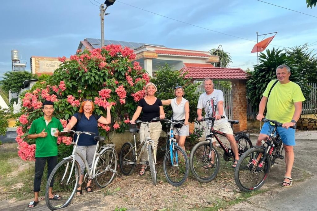 ride a bicyle around the village in ho chi minh city to mekong delta tour