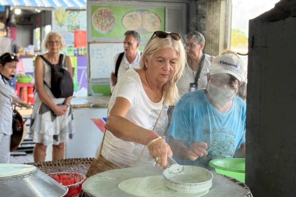 visit of the local workshop to see how to make rice paper in mekong delta tour 8 days