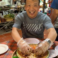 visitor is excited about making bánh xéo vietnam